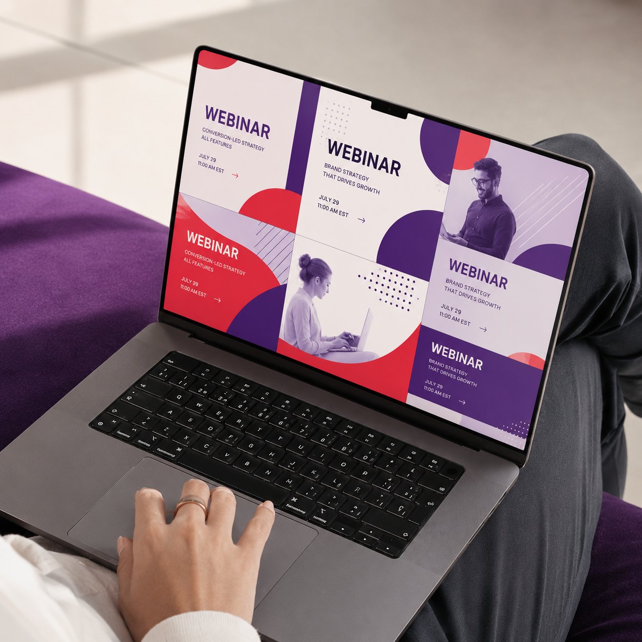 A laptop displaying a webinar campaign landing page in a purple and red palette